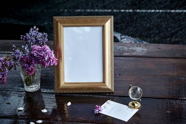 istock Atmospheric stylish mock up frame with lilac flowers. Modern interior, minimalistic concept. Copy space. Trendy template 1330846299