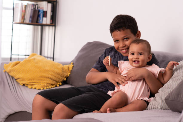 istock Happy brother and baby sister. 1330847010