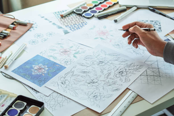 istock Designer designing drawing sketch pattern geometric flower seamless wallpaper fabric textile fashion industry. artistic design studio. 1330857688