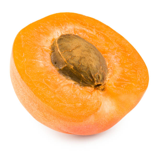istock half of apricot fruit isolated on white background. clipping path 1330859155