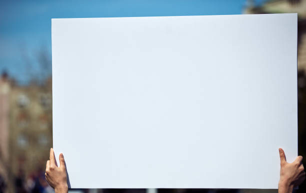 istock Protesters holding placards and signs on the streets. 1330859328