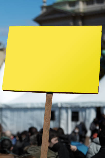 istock Protesters holding placards and signs on the streets. 1330859349