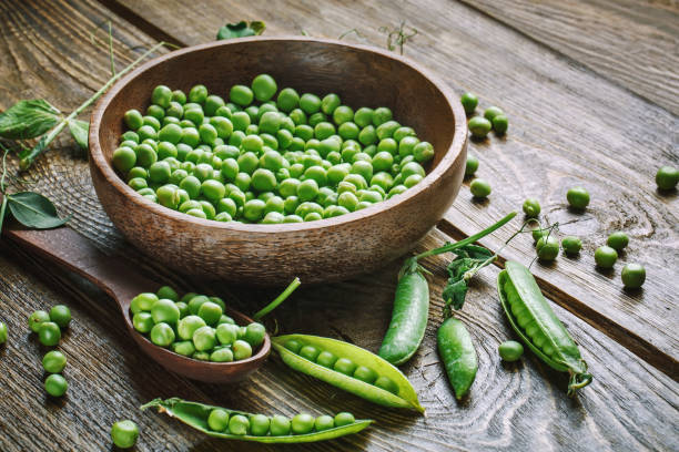 istock Fresh green peas in pods. Horizontal background. Background with copy space. Horizontal. Top view. 1330859394
