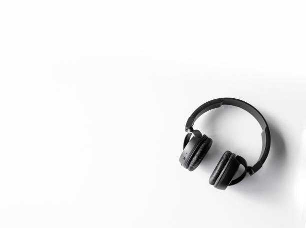istock music lovers background. headphones on a white table 1330863580