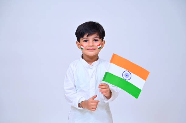 istock Little boy holding tricolor flag studio shot 1330863792