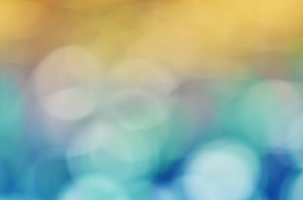istock blurred background with bokeh. gradient color transition from orange to blue 1330865313