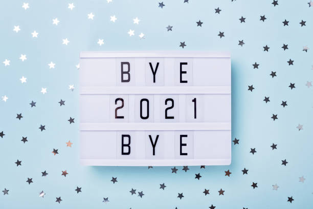 istock Lightbox with text BYE BYE 2021 on blue background. Top view. New year celebration. Happy New Year 2022 concepts 1330866898