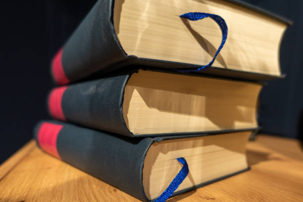 istock Three big black books with empty red area stacked on top of each other 1330867640