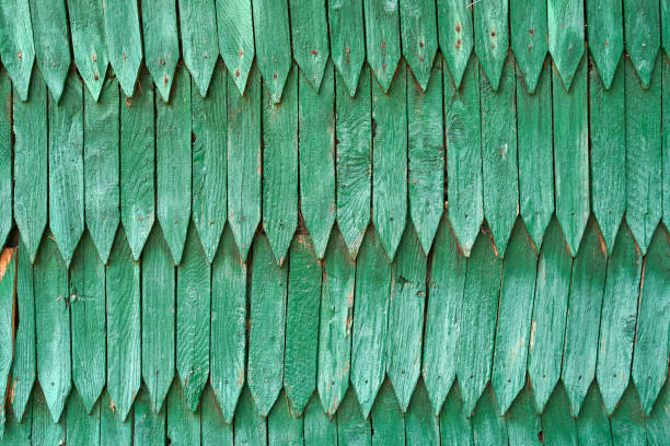 Old weathered green wood shingle wall background