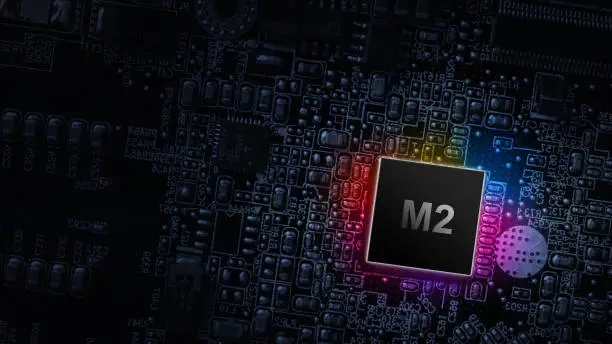 M2 processor chip. Network digital technology with computer cpu chip on dark motherboard background. Protect personal data and privacy from hacker cyberattack
