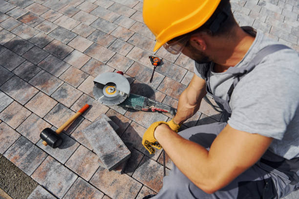 istock Male worker in yellow colored uniform have job with pavement 1330874903
