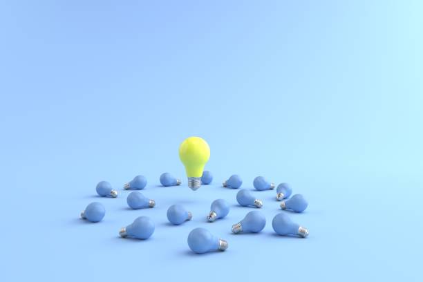 istock 3D rendering of The yellow energy-saving lamp is floating on a blue light bulb placed on a pastel blue floor. and the blue background. concept for new ideas and Outstanding idea, illustration. 1330879592