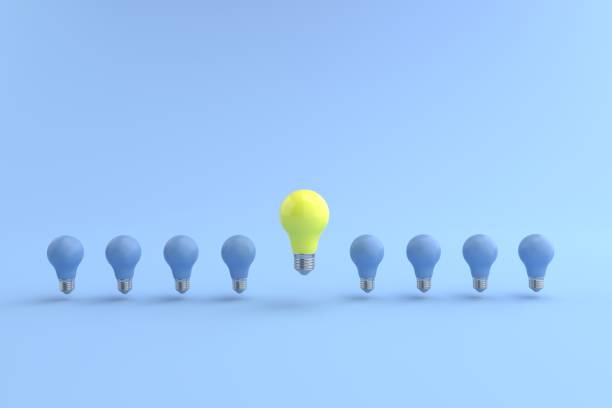 istock 3D rendering of The yellow energy-saving light bulb is floating on a blue light bulb placed on a pastel blue floor. and the blue background. concept for new ideas and Outstanding idea, illustration. 1330879594