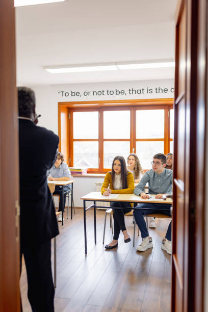 istock African - American high school teacher giving a lecture, writing on a white board 1330879935