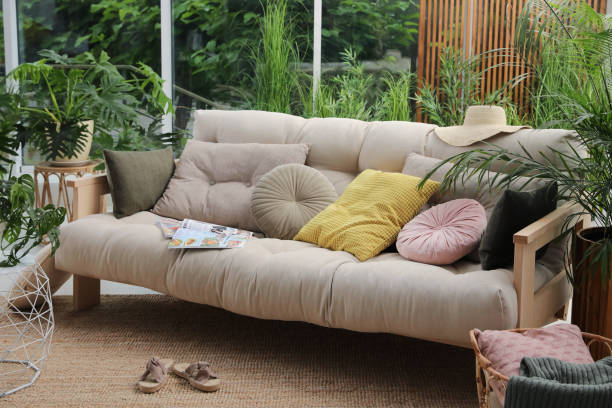 istock Indoor terrace interior with comfortable sofa and green plants 1330882944