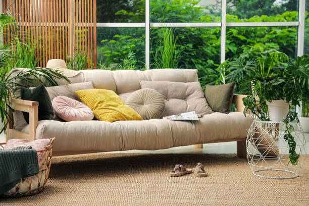istock Indoor terrace interior with comfortable sofa and green plants 1330883200