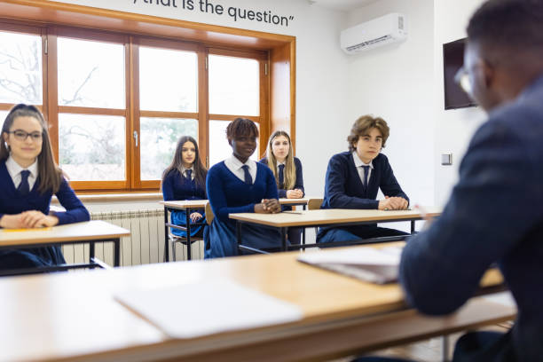 istock High School Teacher and Students In Classroom 1330885833