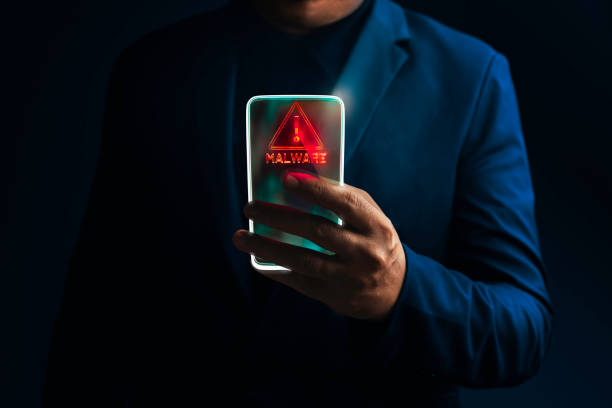 Transparency smart phone with ransomware attack warning sign. Transparency smart phone with ransomware attack warning sign. personal data photos stock pictures, royalty-free photos & images