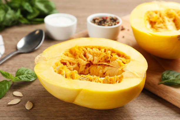 istock Half of fresh spaghetti squash on wooden table. Cooking vegetarian dish 1330890535
