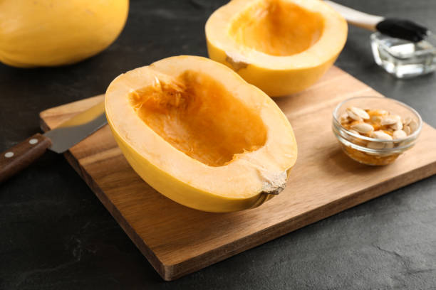 istock Halves of fresh spaghetti squash on black table. Cooking vegetarian dish 1330890670
