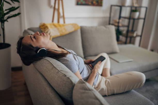 istock Woman relaxing on sofa 1330891207