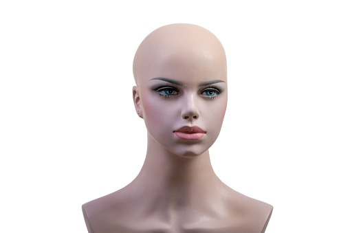 Head of a female mannequin or dummy with make up face isolated on white background