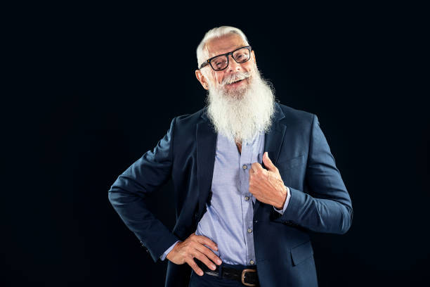 istock Happy senior businessman with white beard smiling and looking at camera. 1330892885