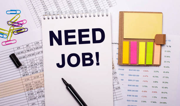 istock Need some work - an inscription in a notebook on the background of reports next to bright stickers and paper clips 1330893514