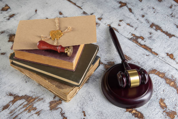 istock Gavel Notary's public and stamp on testament and last will. Notary public tools 1330893889