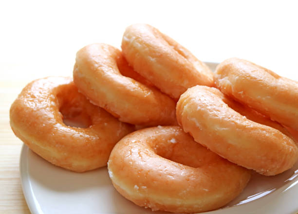 istock Closeup a Plate of Sugar-glazed Doughnuts with Copy Space 1330894086