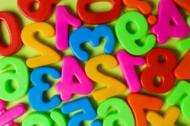 istock Colorful magnetic numbers on light green background, flat lay 1330894134