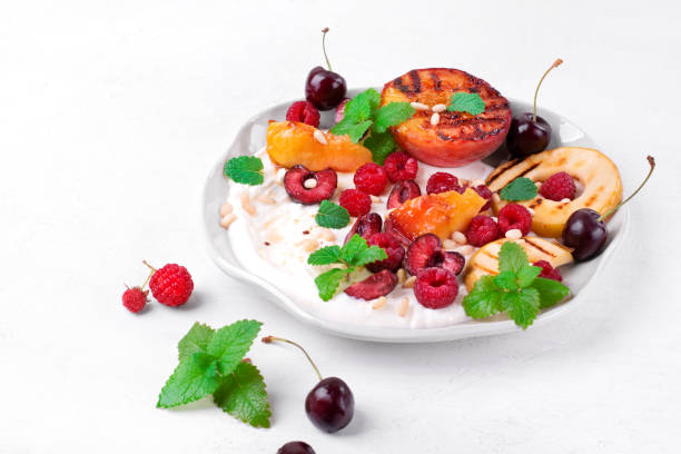 istock Grilled peach and apple in cottage cheese cream. Fruit dessert 1330894433