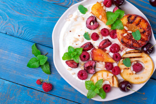 istock Grilled peach and apple in cottage cheese cream. Fruit dessert 1330894449