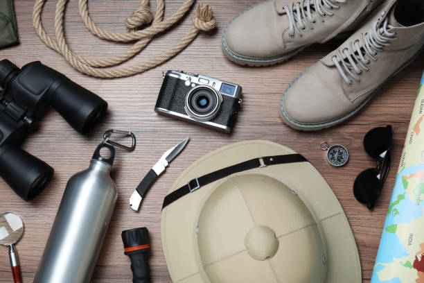 istock Flat lay composition with different safari accessories on wooden background 1330894547
