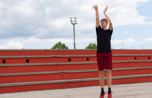 istock Young man on a court shooting some basketball on summer day, practicing, preparing for big game. 1330895621