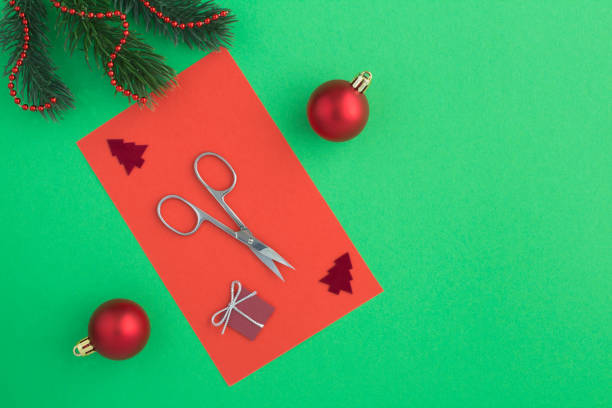 istock Christmas composition with nail scissors on the colored background 1330896457