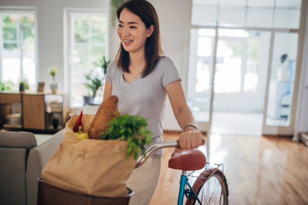 istock Woman back from groceries shopping 1330896683