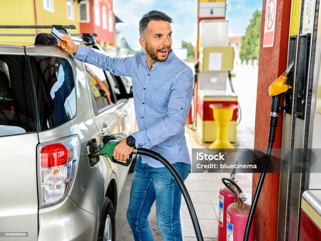 Man refuel the car Refueling Stock Photo