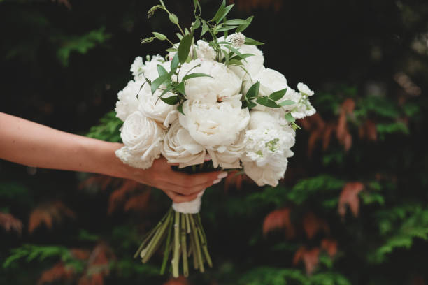 istock Wedding bouquet of white peonies and roses in eco boho rustic style. 1330902240