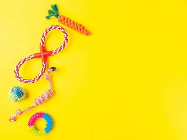 istock Dog rope toys on yellow background. 1330902680