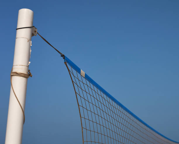 istock beach volleyball pole and net on a blue background 1330902769