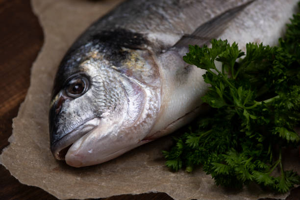 istock Sea bream and ingredients for cooking 1330904565