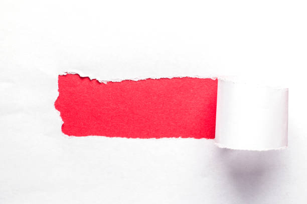 istock Horizontal background with a torn hole in the paper. Background with a red hole in white paper. 1330905184