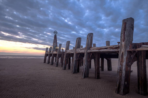 The Old Pier St Anne's Beach. The Old Pier on St Anne's Beach at Lytham St Anne's in Lancashire, England. At Sunset. lytham st. annes stock pictures, royalty-free photos & images
