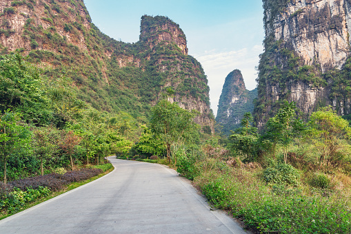 Road between the karst hills near Li River.