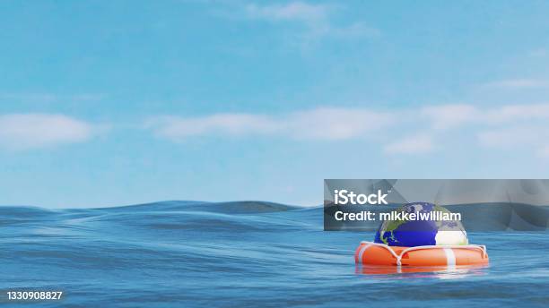 The World Is Saved By A Life Saver At Sea Stock Photo - Download Image Now - Save The Planet, Risk, Climate