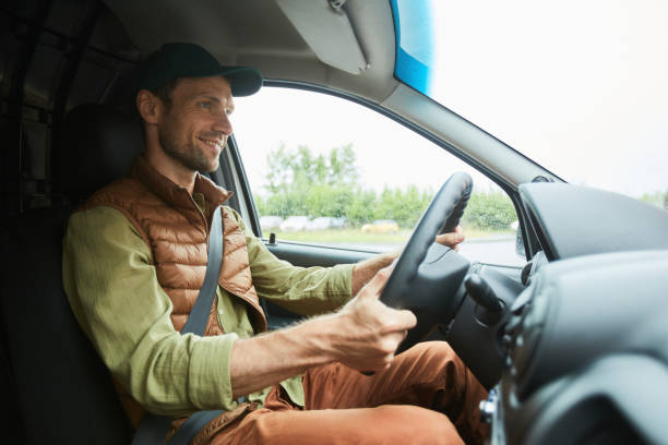 istock Smiling Man Driving Truck 1330909164
