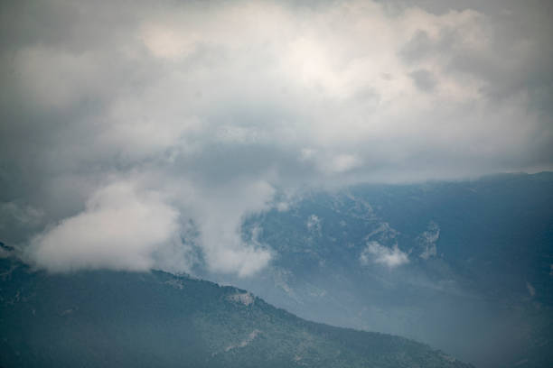 istock gorgeous dramatic mountain panorama with heavy foggy clouds 1330910673