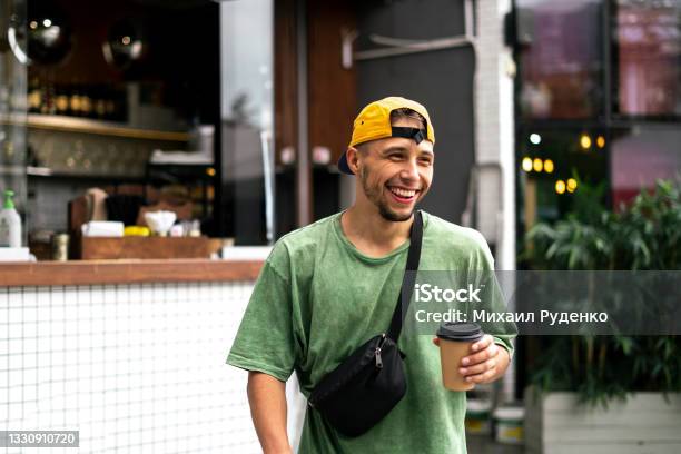 Male Person Walking In The City Street And Drinking The Takeaway Espresso Coffee Stock Photo - Download Image Now