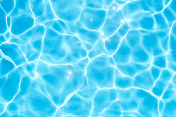 istock Glare on the blue water in the pool. Close-up 1330910755